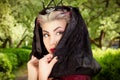 Portrait of a girl dark of the Queen with a crown on her head and make-up Royalty Free Stock Photo