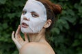 Portrait of a girl face mask Back view touching face with hand cosmetology Royalty Free Stock Photo