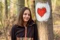 Portrait of girl in the forest smiling to the camera. A girl with long hair in forest Royalty Free Stock Photo