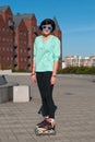 Portrait of girl in a funny sunglasses, who rollerblading in a c Royalty Free Stock Photo