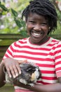 Portrait Of Girl In Garden Looking After Pet Guinea Pig Royalty Free Stock Photo