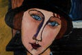 Portrait of a girl in a hat. Beautiful oil painting on canvas. Based on the magnificent painting by Modigliani. Brush strokes and