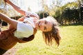 Portrait Of Girl Having Fun On Tyre Swing In Garden At Home Royalty Free Stock Photo