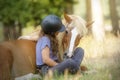 A girl and her beautiful sorrel pony showing tricks learned with natural dressage Royalty Free Stock Photo