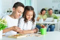 Portrait of girl and her her brother studying together Royalty Free Stock Photo