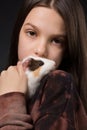 Portrait of a girl and her pet - a guinea pig, close-up Royalty Free Stock Photo