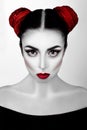 Portrait of a girl in a high fashion, beauty style with white skin, red lips make up at silver background. Vampire makeup Art Royalty Free Stock Photo