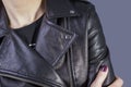 Close-up portrait of a girl in a high-quality leather jacket. Rock and roll style in women. Promotional photo of a leather jacket Royalty Free Stock Photo