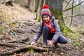 Portrait of girl on hiking forest trip tying shoe laces