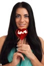 Portrait of a girl holding heart shape candy