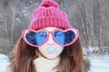 Portrait girl in huge glasses and gum-chewing