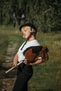 Portrait of a girl - a jockey, who holds a horse - a toy in her hands Royalty Free Stock Photo