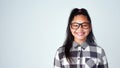 Portrait, girl and kid with glasses, student and confident geek on blue studio background. Face, happy person and model Royalty Free Stock Photo