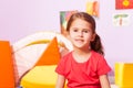 Portrait of girl in kindergarten room