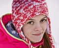 Portrait of a girl in a knitted hat.Looking straight into the lens.