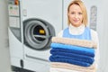 Portrait of a girl Laundry worker holding a clean towel Royalty Free Stock Photo