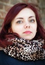 Portrait of a girl with a leopard scarf around her neck