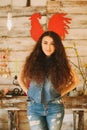 Portrait of a girl with long, curly, natural hair. Red