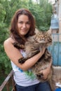 Girl with a Maine Coon cat Royalty Free Stock Photo