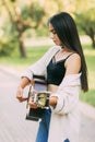 Portrait of a girl-a musician playing the guitar in nature. Vacation, vacation, hobby. Women musicians, music