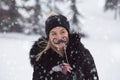 Portrait of girl with mustache paper props on snowy day.