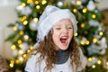 Portrait of a girl near the Christmas tree