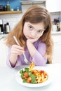 Portrait Of Girl Not Enjoying Healthy Meal At Home Royalty Free Stock Photo