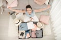 Portrait of a girl packing things and looking at camera Royalty Free Stock Photo
