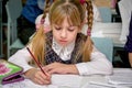 Portrait of a girl with pigtails in the classroom