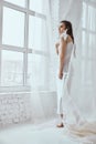 Portrait of girl posing with lily flower. Royalty Free Stock Photo