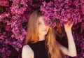 Portrait of girl among purple bougainvillaea Royalty Free Stock Photo