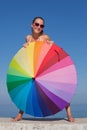 Portrait of girl with rainbow parasol