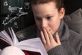 Portrait of a girl reading very scary book Royalty Free Stock Photo