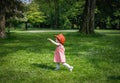 Portrait of a girl in a red Belgian flag hat in the park. Royalty Free Stock Photo