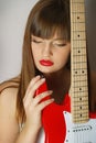 Portrait of girl with the red guitar