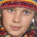 Portrait of a girl's face while snowing