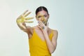 Portrait of a girl with smeared makeup. hand shows the stop sign Royalty Free Stock Photo