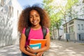 Portrait of girl smile with textbooks near school Royalty Free Stock Photo