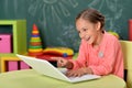 Portrait of girl studing with laptop at classroom Royalty Free Stock Photo