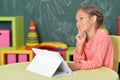 Portrait of girl studing with tablet at classroom Royalty Free Stock Photo