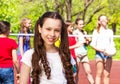 Portrait of girl with teens playing volleyball Royalty Free Stock Photo