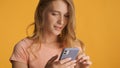 Portrait of girl texting with friend in online chat on smartphon