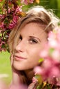 Portrait of a girl under a cherry blossom tree Royalty Free Stock Photo