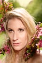 Portrait of a girl under a cherry blossom tree Royalty Free Stock Photo