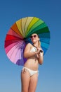 Portrait of girl under rainbow parasol Royalty Free Stock Photo