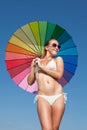 Portrait of girl under rainbow parasol Royalty Free Stock Photo