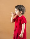 Portrait of a girl using asthma inhaler Royalty Free Stock Photo