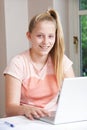 Portrait Of Girl Using Laptop At Home Royalty Free Stock Photo