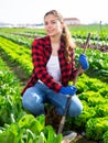 Portrait of girl vegetable grower in family vegetable farm