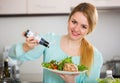 Portrait of girl with vegetable salad and balsamico